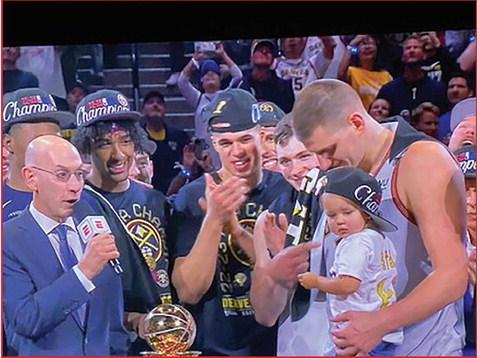 NBA Commissioner Adam Silver presents the NBA Finals MVP Award to Nikola Jokic, holding his daughter and flanked by team members including Mizzou alum Michael Porter (center) and KU alum Christian Braun (center, right). photo/screenshot